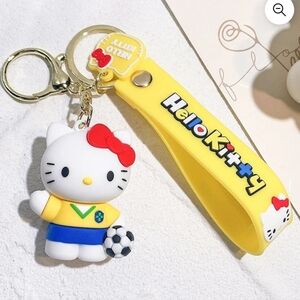 Hello Kitty Soccer Doll Keychain with Red Bow and Yellow Strap